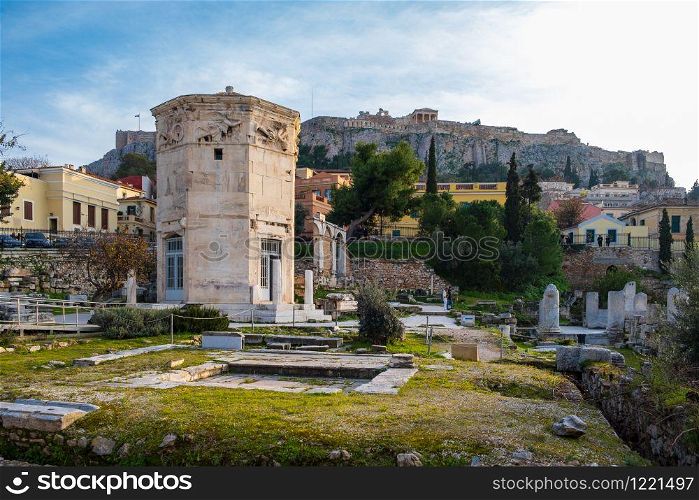 Tower of the Wind-gods in Roman Agora and Acropolis in the background shot on a winter afternoon