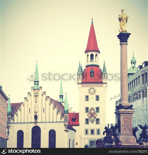 Town hall and Marian column on Marienplatz in Munich, Germany. Retro style filtered image