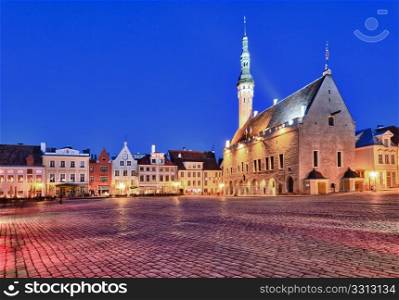 Town hall in Raekoja square in Tallinn in Estonia at dusk as the buildings are illuminated