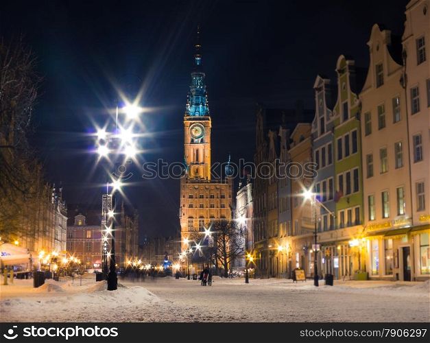 Town Hall of the Main City (Polish: Ratusz) in Gdansk Danzig Poland Europe, built in Gothic and Renaissance architectural styles. Long Street Market. Winter snow night scenery