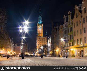 Town Hall of the Main City (Polish: Ratusz) in Gdansk Danzig Poland Europe, built in Gothic and Renaissance architectural styles. Long Street Market. Winter snow night scenery