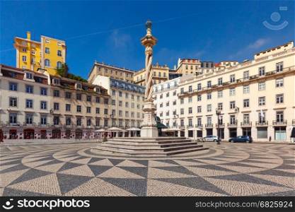 Town Hall Square in Lisbon, Portugal. Town Hall Square with a beautiful geometric mosaic in Lisbon, Portugal. In the center of the square the pillory The Pelourinho de Lisboa
