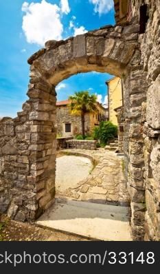 Town of Hum stone gate and street vertical view, Istria, Croatia
