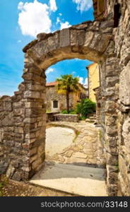 Town of Hum stone gate and street vertical view, Istria, Croatia