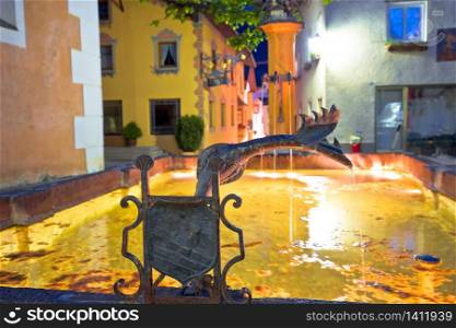 Town of Kastelruth or Castelrotto fountain and street evening view, Dolomites Alps region of Italy