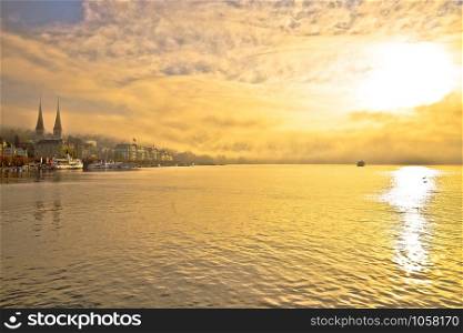 Town of Lucerne mystic morning fog view from lake, central Switzerland