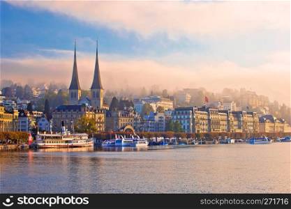 Town of Luzern morning fog view from lake, central Switzerland