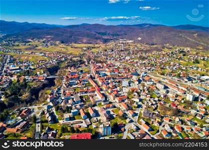 Town of Ogulin and Dobra river canyon aerial panoramic view, landscape of central Croatia