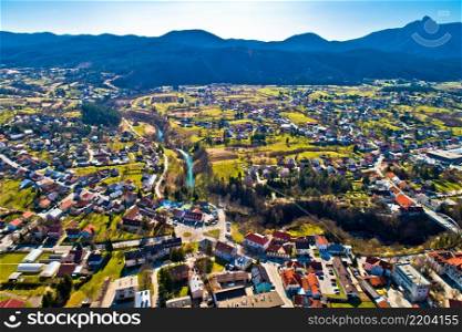 Town of Ogulin and Dobra river canyon aerial panoramic view, landscape of central Croatia