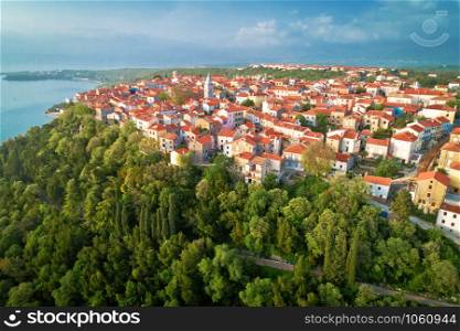Town of Omisalj on Krk island green hill aerial view, Kvarner bay of Croatia
