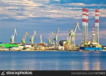Town of Pula shipyard cranes view from the sea, Istria region of Croatia