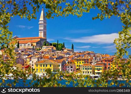 Town of Rovinj ancient architecture and waterfront view through leaf frame, Istria, region of Croatia