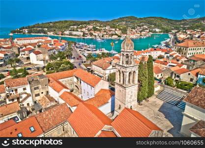 Town of Vela Luka on Korcula island church tower and coastline aerial view, archipelago of southern Dalmatia, Croatia
