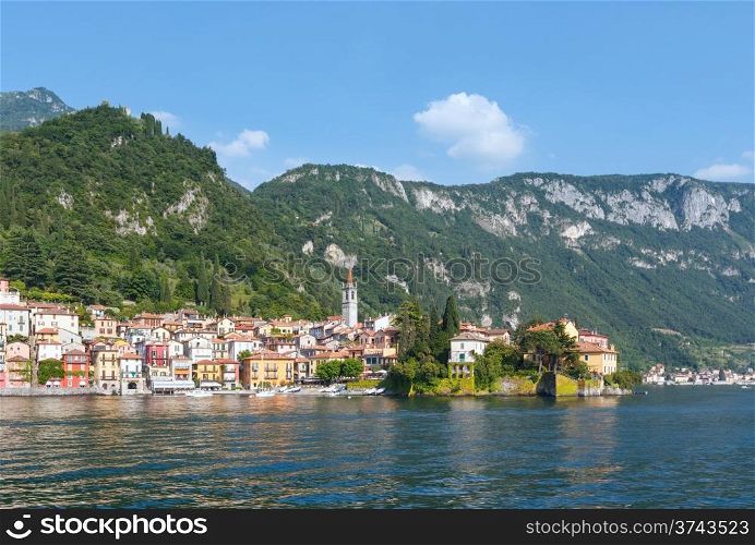 Town on Lake Como coast (Italy). Summer view from ship board