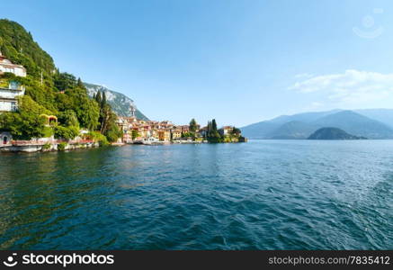 Town on Lake Como coast (Italy). Summer view from ship board