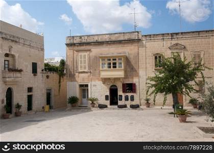 town square with old buildings in victoria village or rabat on the malta island gozo