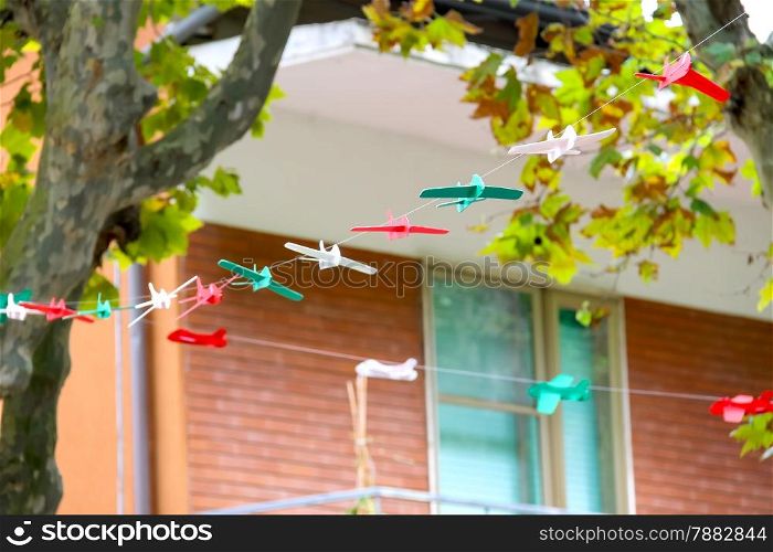 Toy airplanes decorate street in the resort town Bellaria Igea Marina, Rimini, Italy