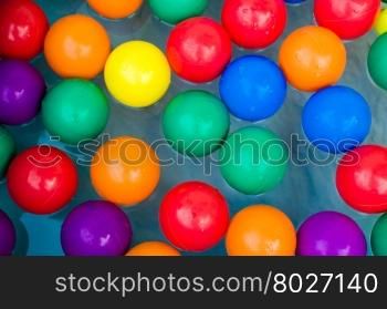 Toy balls in water.