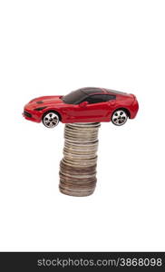 Toy car and stack of coins isolated on white background