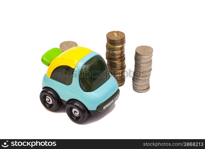 Toy car over a lot of coins isolated on white