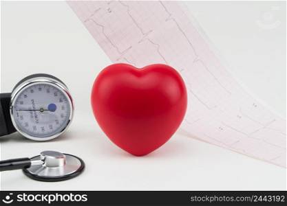 Toy heart and stethoscope on electrocardiogram background. Concept healthcare. Cardiology - care of the heart. cardiology, heart care