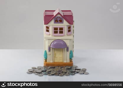 Toy house and coins