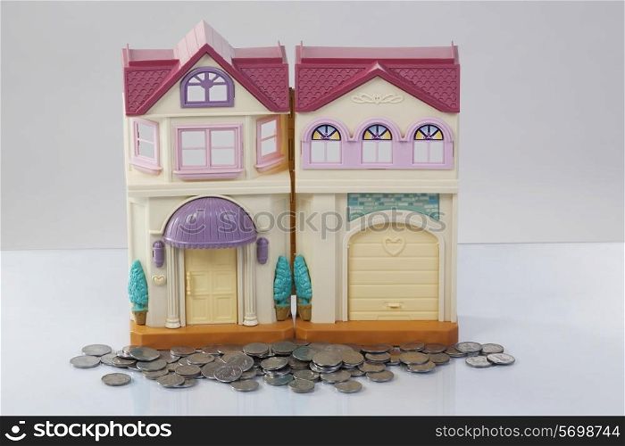 Toy house and coins