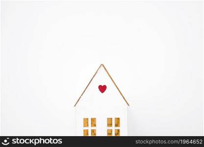 toy house with small heart. High resolution photo. toy house with small heart. High quality photo