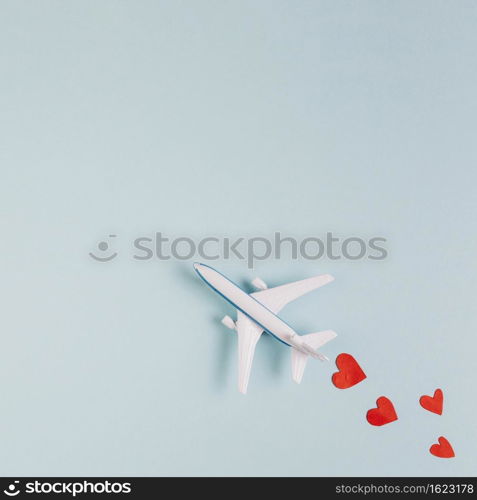toy plane model with read hearts