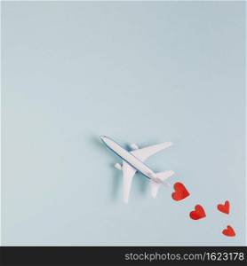 toy plane model with read hearts