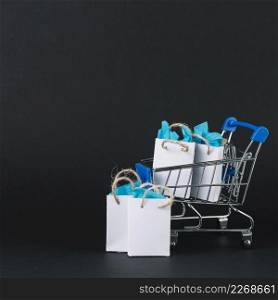 toy shopping trolley with gifts packets