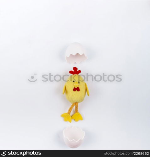 toy small chicken with egg shell white table