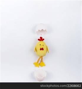 toy small chicken with egg shell white table