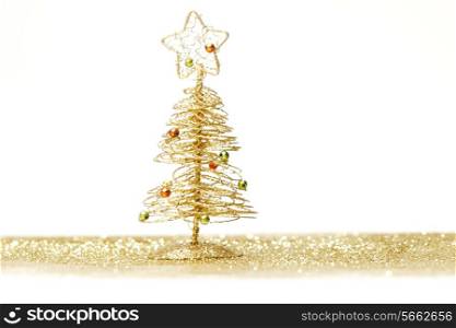 Toy small Christmas tree with decoration on white background