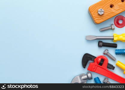 Toys tools on blue background. Copy space. Flat lay. Top view