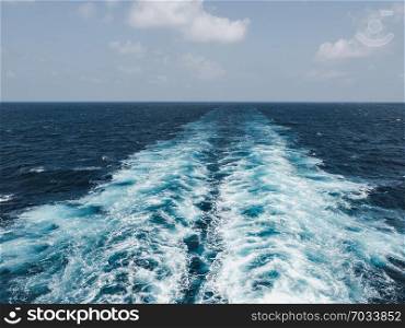 Trace of a cruise liner on the sea surface. Concept of leisure and travel. Trace of a cruise liner on the sea surface