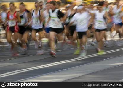 Track athletes running on a running track