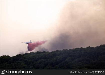 Tracker water bomber in the sky of southern France from extinguishing a forest fire.