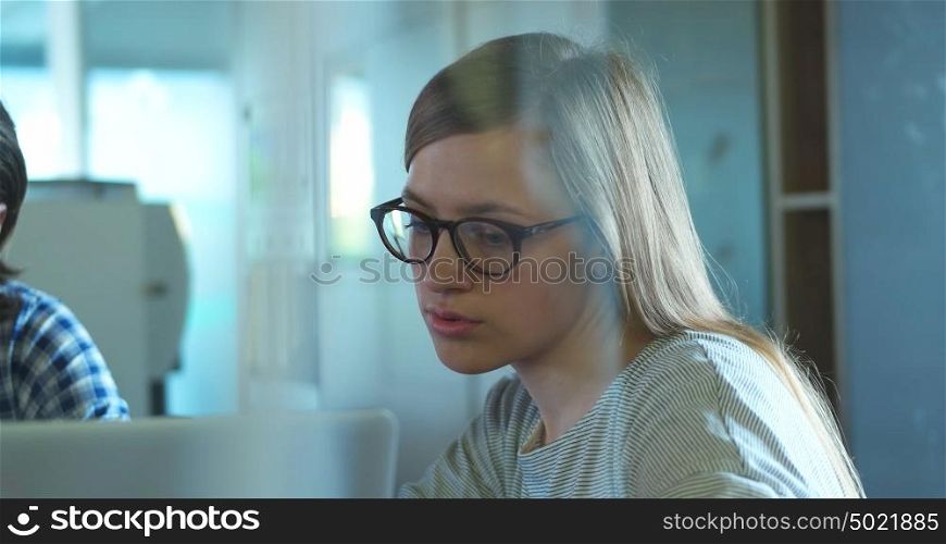tracking shot of Young Woman In A Startup Office
