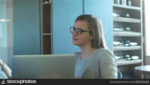 tracking shot of Young Woman In A Startup Office