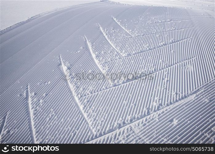 Tracks in the snow on a groomed trail at ski resort, Sunshine Ski Resort, Banff National Park, Alberta, Canada