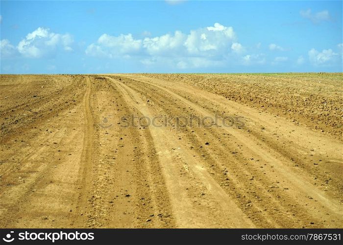 Tracks on the plowed land in Israel
