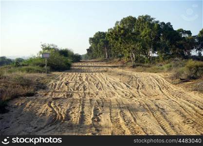 Tracks on the wide dirt road near Nahal Alexander in Israel