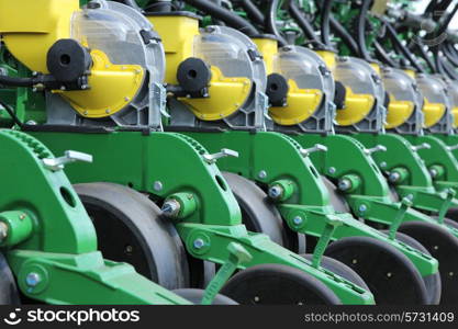 tractor and seeder planting crops on a field