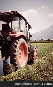 Tractor on an agriculture field, cut out