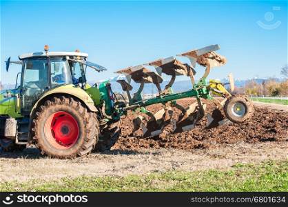 Tractor plowing the field
