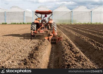 tractor preparation soil working in field agriculture.