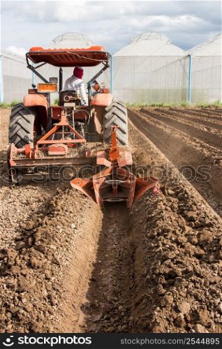tractor preparation soil working in field agriculture.