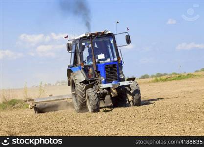 Tractor works in the field