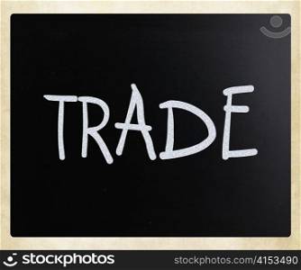 ""Trade" handwritten with white chalk on a blackboard"